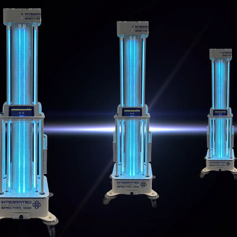 Three vertical UV-C disinfection towers on wheeled bases, glowing blue light in a dark background, for room sterilization.